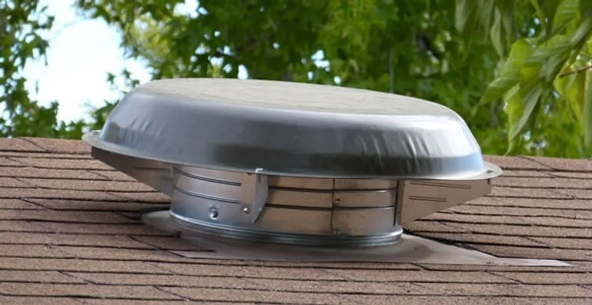 attic fan installation services with low-profile roof ventilation unit in Grand Rapids, MI