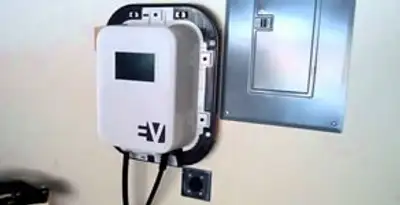 Electric car charger installation with wall-mounted EV charging station in Grand Rapids, MI