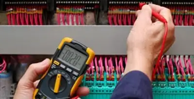 electrical service showing professional testing and troubleshooting of electrical panel by licensed electricians in Grand Rapids, MI