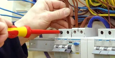 electrician services performing professional electrical panel wiring and connections in Grand Rapids, MI