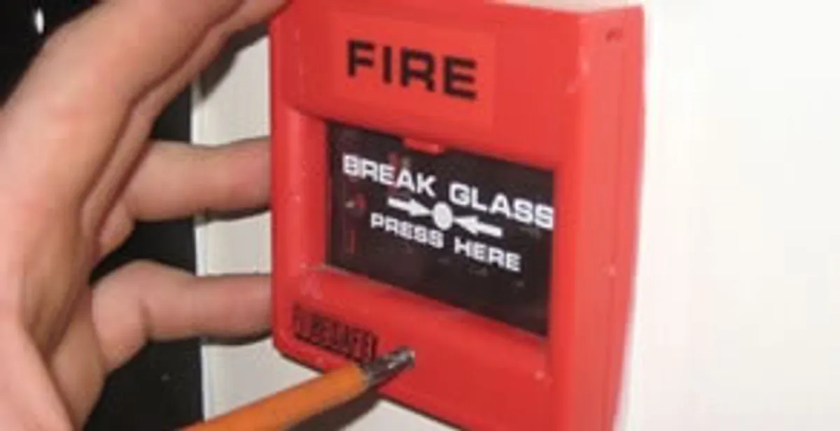 fire alarm installation service showing manual fire alarm pull station installed by licensed electricians in Grand Rapids, MI