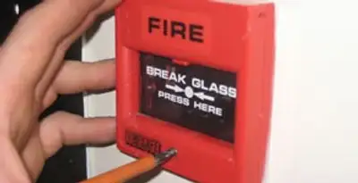 fire alarm installation service showing manual fire alarm pull station installed by licensed electricians in Grand Rapids, MI
