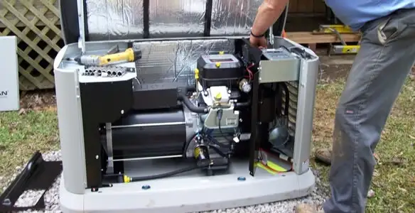 generator installation service showing technician connecting and configuring generator components in Grand Rapids, MI