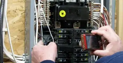 Home electrical inspection of circuit breaker panel by licensed electrician in Grand Rapids, MI