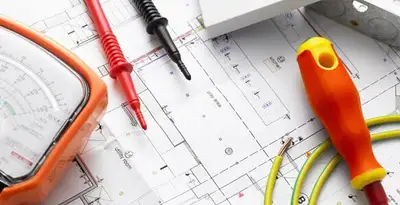licensed electrician planning and testing electrical systems using professional tools in Grand Rapids, MI