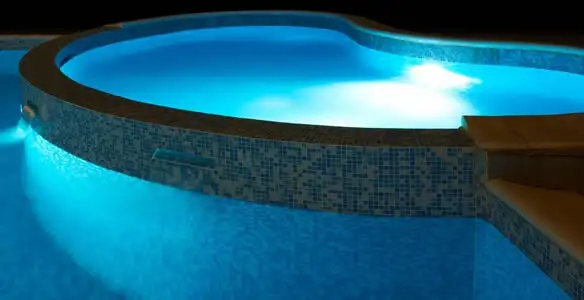 pool light installation and repair services highlighting illuminated pool interior lighting in Grand Rapids, MI