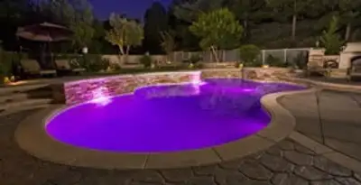pool light installation and repair services illuminating a residential swimming pool in Grand Rapids, MI