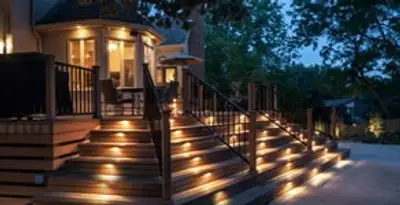 Residential electrician installing outdoor lighting for home safety in Grand Rapids, MI