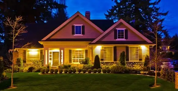security light installation services illuminating a residential exterior at night in Grand Rapids, MI