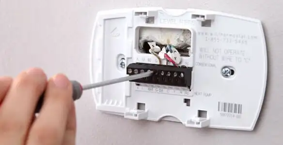 Thermostat installation service with proper wiring and secure wall mounting in Grand Rapids, MI