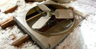 whole house fan installation services with attic-mounted ventilation unit in Grand Rapids, MI